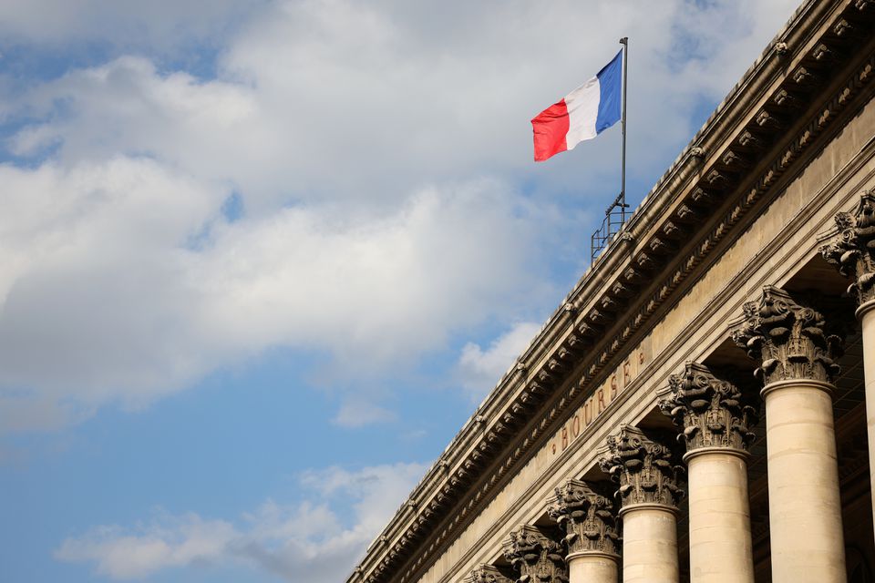 A view shows the French national flag on the top of the Palais Brogniard, former Paris Stock Exchange, located at Place de la Bourse in Paris, France, March 9, 2022. REUTERS/Sarah Meyssonnier

