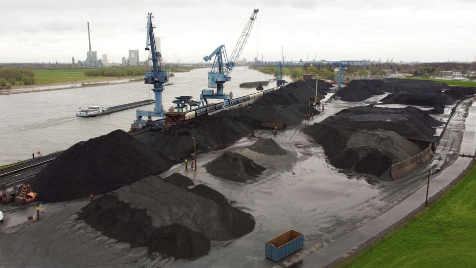 An aerial view shows coal at a dry bulk terminal of German Rheinberg-Orsoy harbor along Europe’s most important shipping way Rhine in Rheinberg near Duisburg, Germany, April 6, 2022. Picture taken with a drone. REUTERS/Stephane Nitschke