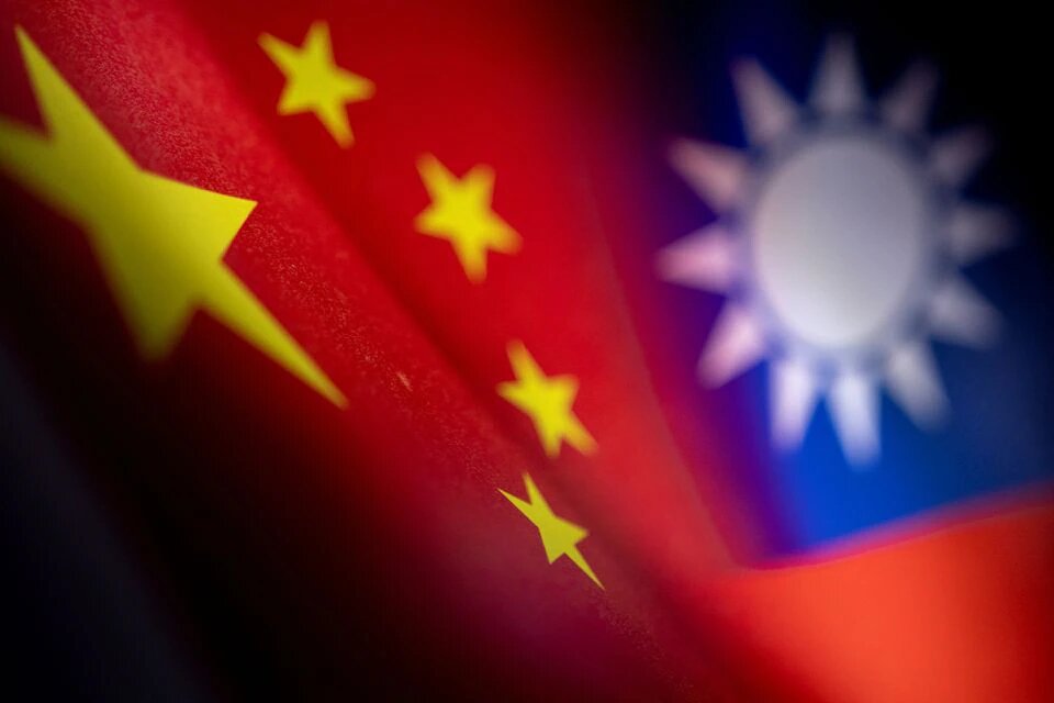 Chinese and Taiwanese printed flags are seen in this illustration taken, April 28, 2022. Picture taken April 28, 2022. REUTERS/Dado Ruvic/Illustration


