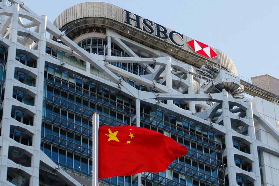 A Chinese national flag flies in front of HSBC headquarters in Hong Kong, China, July 28, 2020. REUTERS/Tyrone Siu
