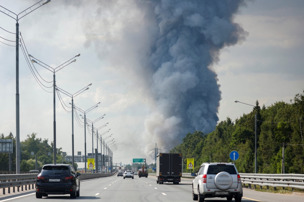 Smoke rises above Ozon e-commerce firm's warehouse in Istrinsky District of the Moscow region, Russia August 3, 2022. REUTERS/Maxim Shemetov