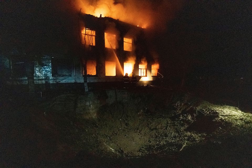 Firefighters extinguish a burning hospital building hit by a Russian missile strike, as Russia's attack on Ukraine continues, in Mykolaiv, Ukraine August 1, 2022. REUTERS/Stanislav Kozliuk/File Photo