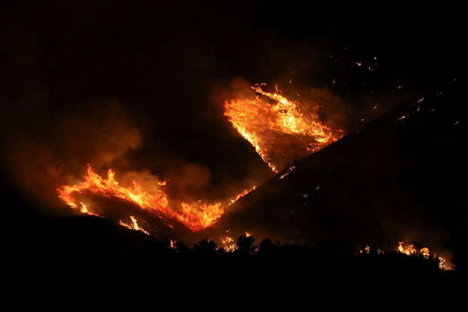 A wildfire burns at Bushat, Shkoder, Albania August 3, 2022. REUTERS/Florion Goga

