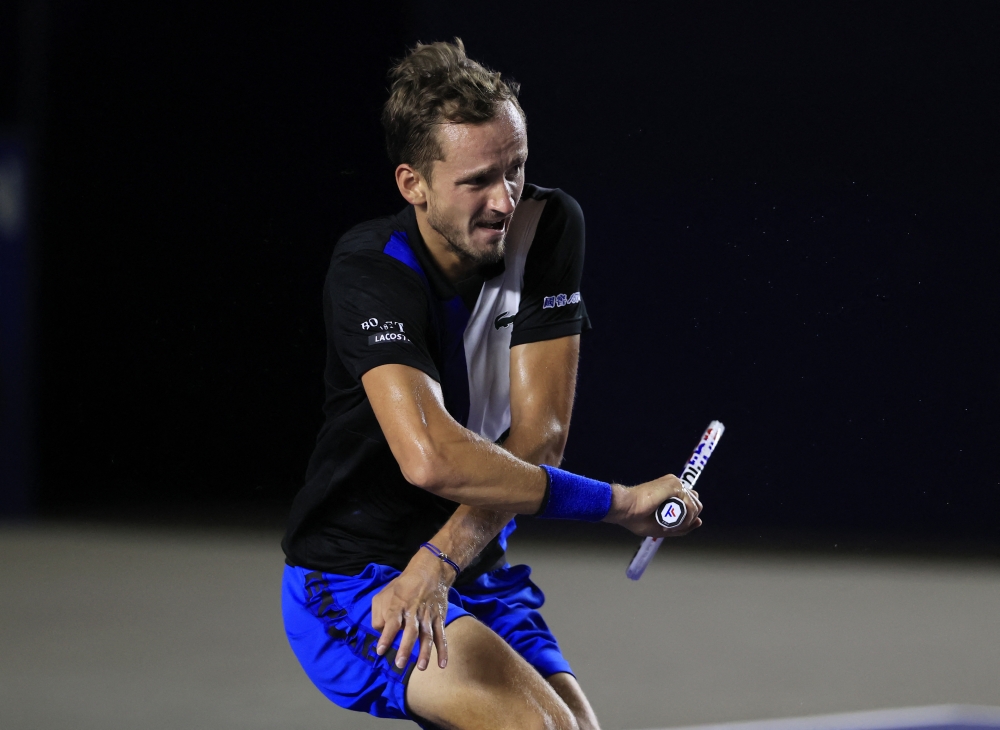 August 6, 2022 Russia's Dannil Medvedev reacts after sustaining an injury during his final match against Britain´s Cameron Norrie REUTERS/Carlos Perez Gallardo