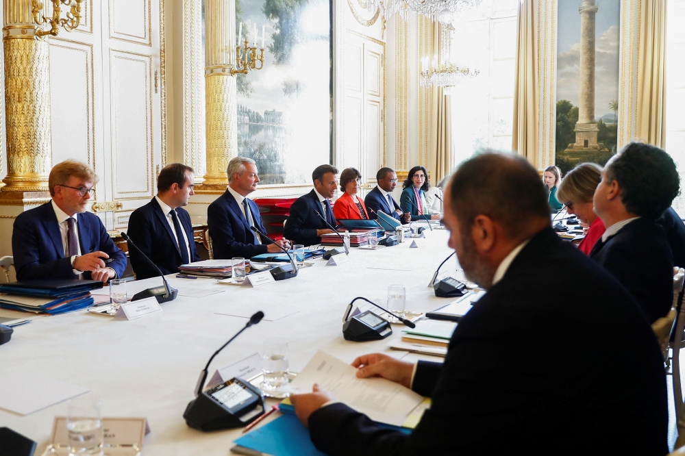French President Emmanuel Macron attends the cabinet meeting at the Elysee Palace in Paris, France August 24, 2022. Mohammed Badra/Pool via REUTERS