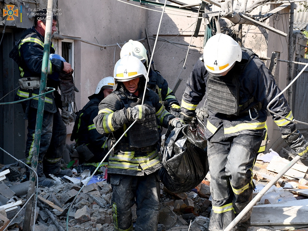 Emergency personnel work after the shelling of a private residential complex, in Mykolaiv, Ukraine, on August 29, 2022 in this picture obtained from social media. SES Ukraine/via REUTERS 