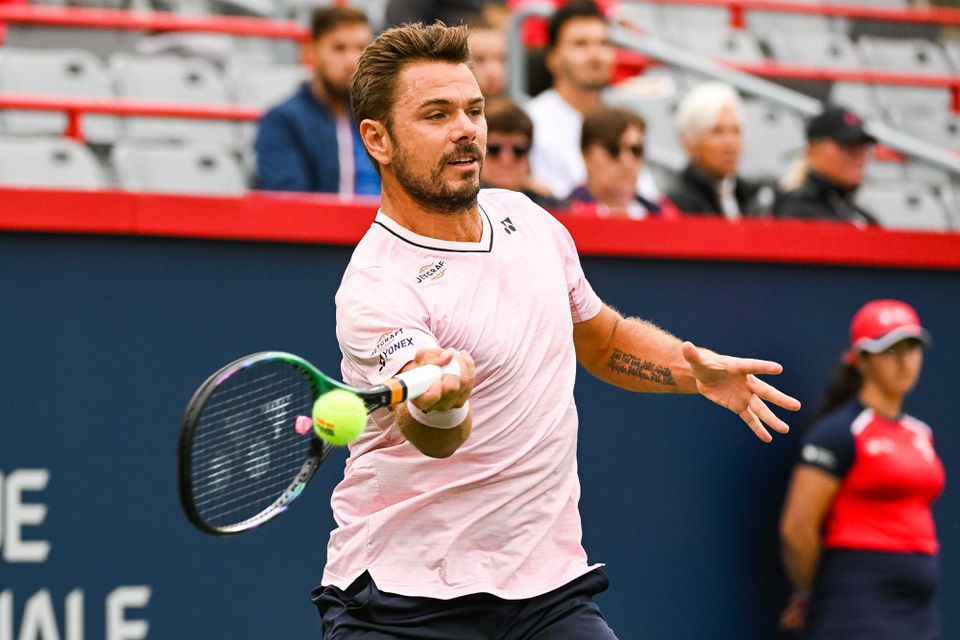 Aug 8, 2022; Montreal, Quebec, Canada; Stan Wawrinka (SUI) hits a shot against Emil Ruusuvuori (FIN) (not pictured) during first round play at IGA Stadium. Mandatory Credit: David Kirouac-USA TODAY Sports


