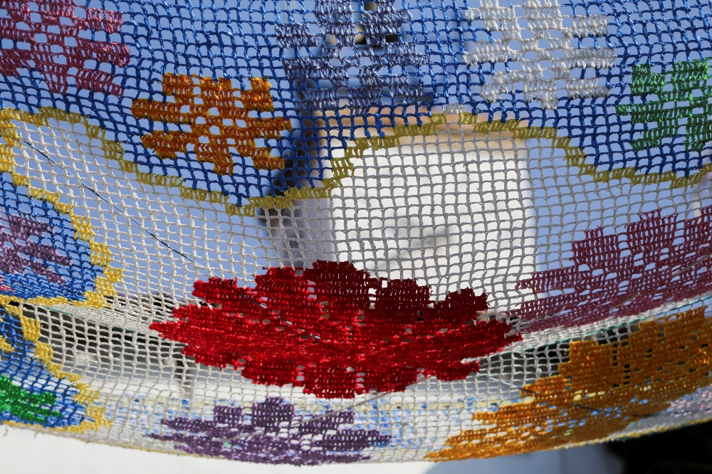 A detail view of a canopy created with recycled material displayed over the main square of Valverde de la Vera as part of the 