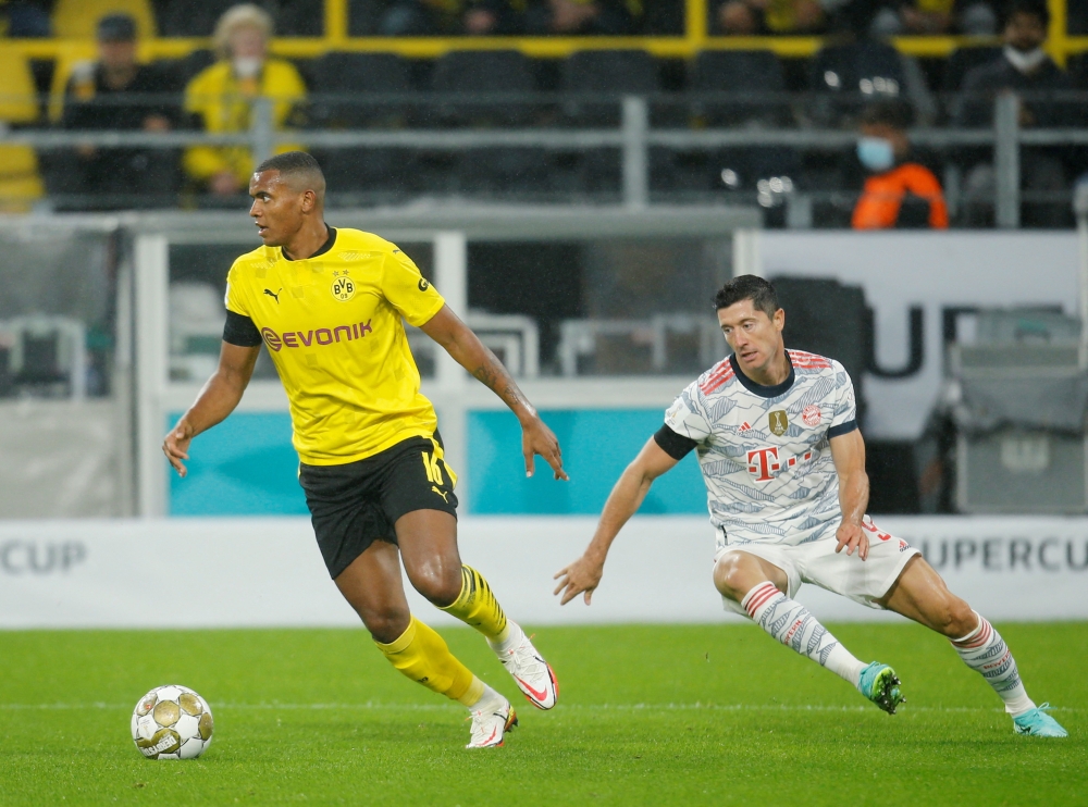 Borussia Dortmund's Manuel Akanji (left) in action against Bayern Munich's Robert Lewandowski during a German Bundesliga match at Signal Iduna Park in Dortmund, on August 17, 2021. 
  REUTERS/Leon Kuegele
