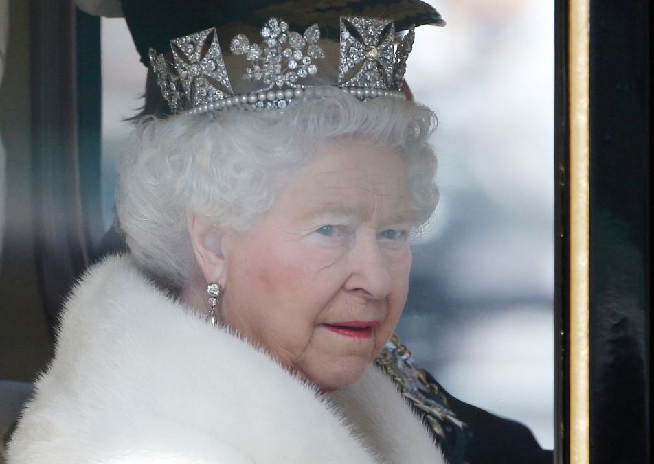 Britain's Queen Elizabeth is driven by carriage from Buckingham Palace to the Houses of Parliament during the State Opening of Parliament in central London, Britain, on May 27, 2015. (REUTERS/Peter Nicholls)