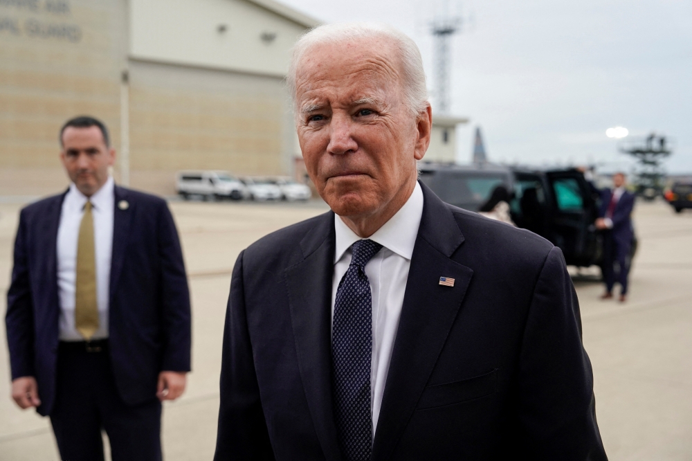 U.S. President Joe Biden speaks to media before boarding Air Force One as he departs for Washington from New Castle, Delaware, U.S., September 11, 2022. REUTERS/Joshua Roberts
