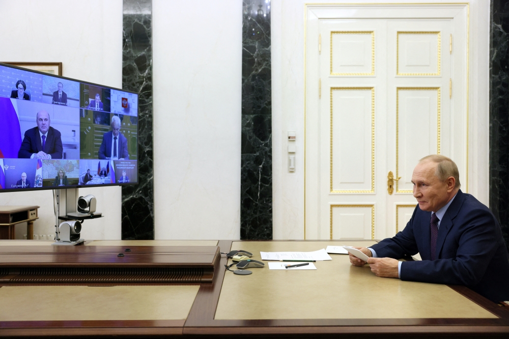 Russian President Vladimir Putin chairs a meeting on economic issues via a video conference call in Moscow, on September 12, 2022. Sputnik/Gavriil Grigorov/Pool via REUTERS