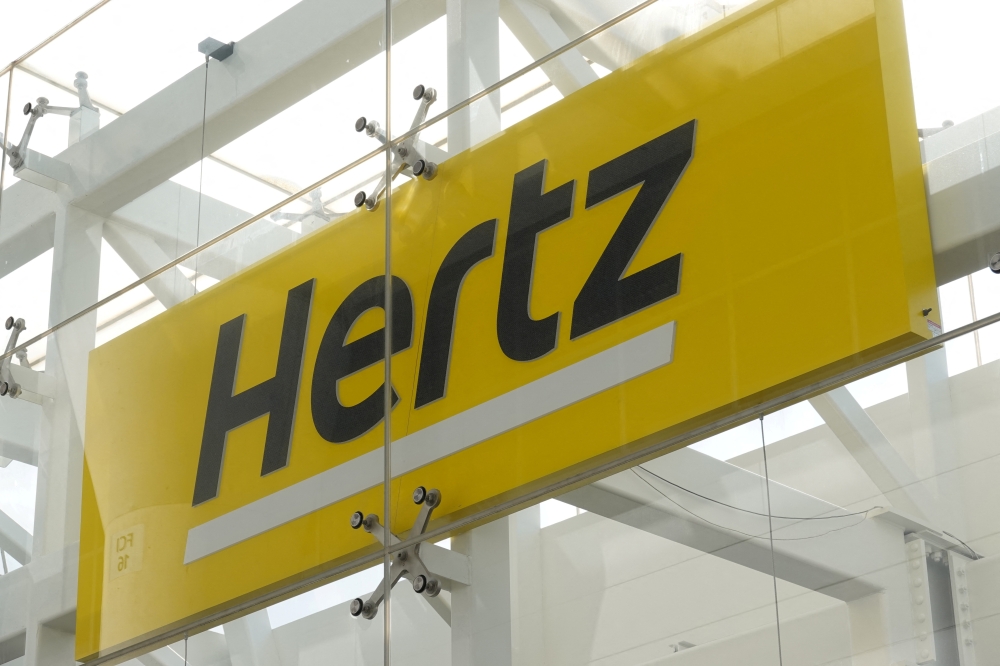 Signage is seen at Hertz rental car at John F. Kennedy International Airport in Queens, New York City, on  March 30, 2022. File Photo / Reuters
