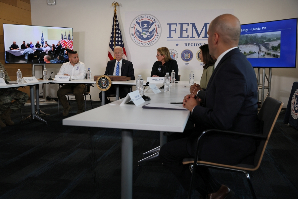 US President Joe Biden receives a briefing on hurricane Fiona’s impact on Puerto Rico from FEMA and other officials at the FEMA Region 2 office in New York on September 22, 2022. REUTERS/Leah Millis