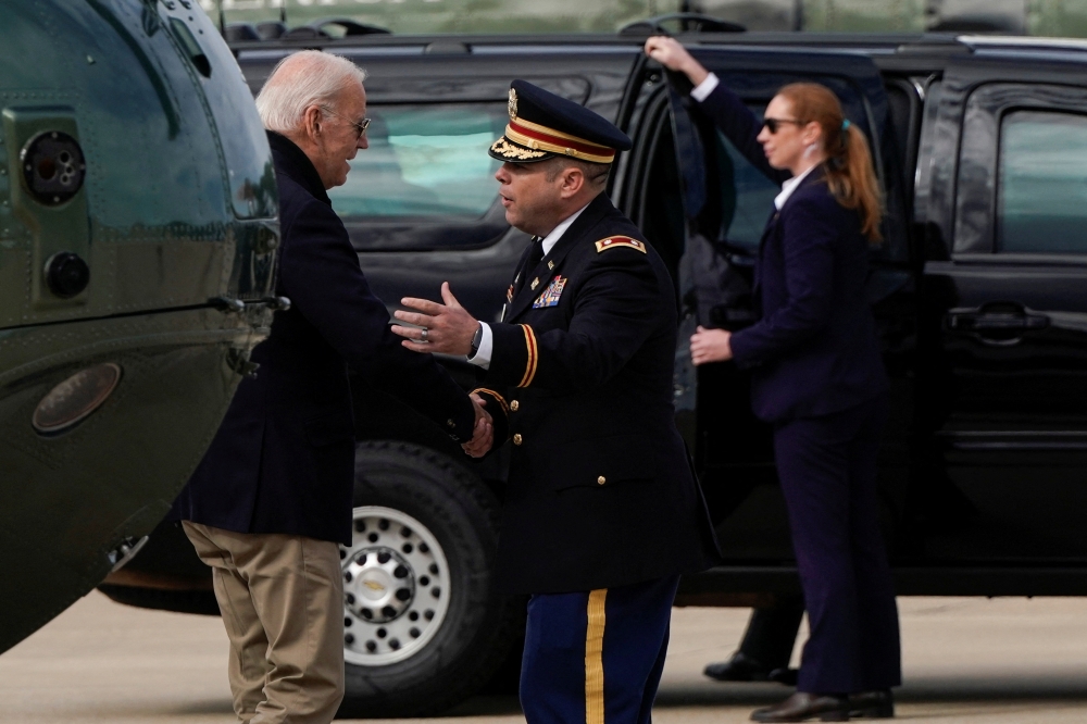 US President Joe Biden is greeted as he walks from Marine One upon arrival from Washington in New Castle, Delaware, on September 24, 2022. REUTERS/Joshua Roberts