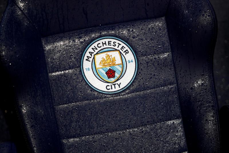 General view of a Manchester City badge on a rain soaked seat before a match against West Ham United at the Etihad Stadium in Manchester on February 19, 2020. File Photo / Reuters
