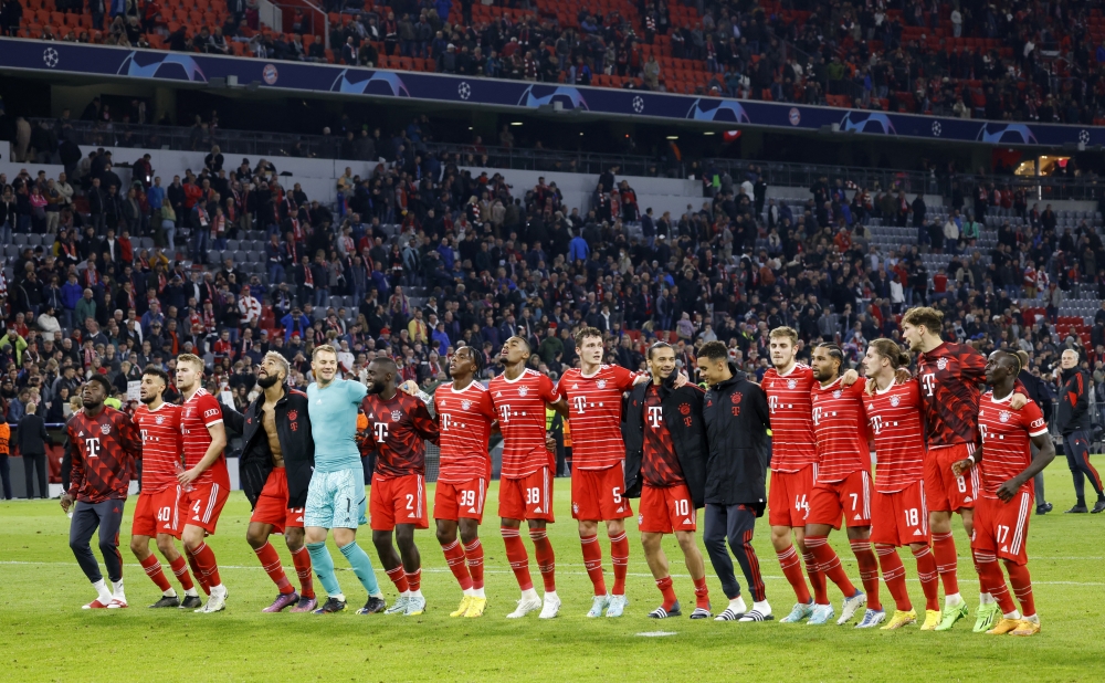   Bayern Munich players celebrate after their UEFA Champions League match against Viktoria Plzen at the Allianz Arena in Munich on October 4, 2022.  REUTERS/Michaela Rehle