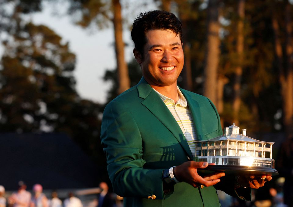 Japan's Hideki Matsuyama celebrates with the green jacket and the trophy after winning The Masters at the Augusta National Golf Club in Augusta, Georgia, US, on April 11, 2021.  File Photo / Reuters