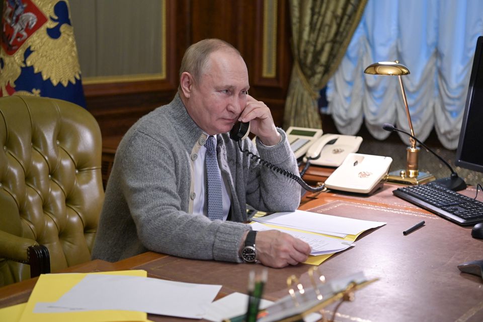 Russian President Vladimir Putin speaks on the phone during a conversation with a participant of a Christmas charity event in Strelna on the outskirts of Saint Petersburg, Russia, on December 27, 2021. File Photo / Reuters