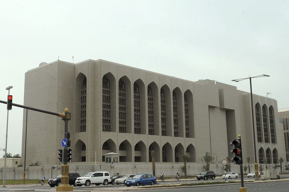 Vehicles stop at a red light in front of the main branch of UAE Central Bank in Abu Dhabi, on January 29, 2013.  File Photo / Reuters