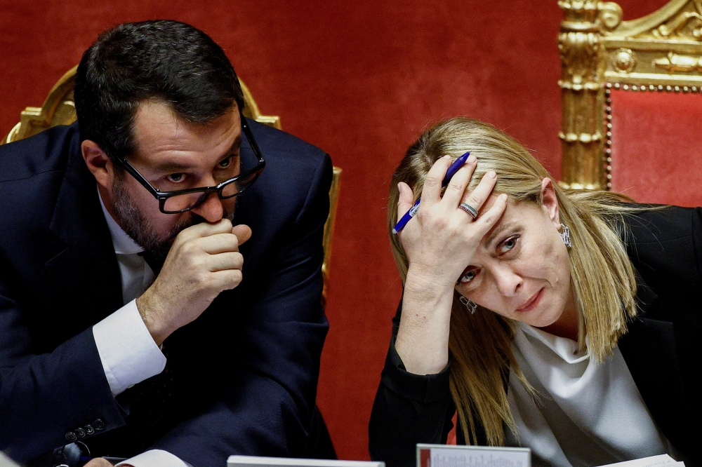 Italy's Prime Minister Giorgia Meloni and Infrastructure Minister Matteo Salvini attend a session of the upper house of parliament ahead of a confidence vote for the new government, in Rome, Italy, on October 26, 2022. REUTERS/Guglielmo Mangiapane/File Photo