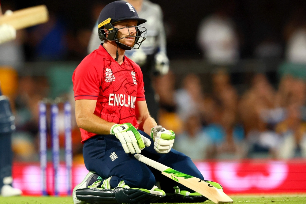 England's Captain Jos Buttler reacts after his dismissal during the ICC men's Twenty20 World Cup 2022 cricket match between England and New Zealand at The Gabba on November 1, 2022 in Brisbane. Photo by Patrick Hamilton / AFP