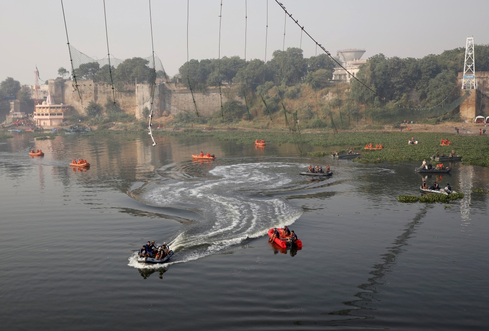 Rescuers conduct search operation after a suspension bridge collapsed on Sunday, in Morbi town in the western state of Gujarat, India, November 1, 2022. REUTERS/Stringer