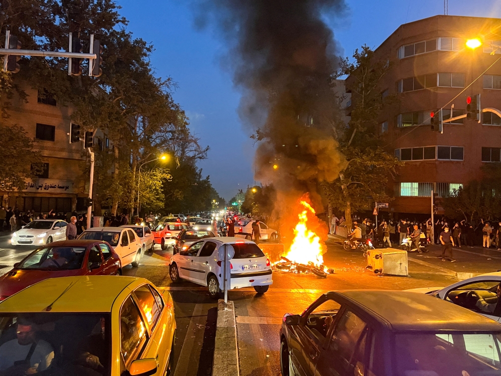 File photo: A police motorcycle burns during a protest over the death of Mahsa Amini in Tehran, Iran, September 19, 2022. (Reuters)