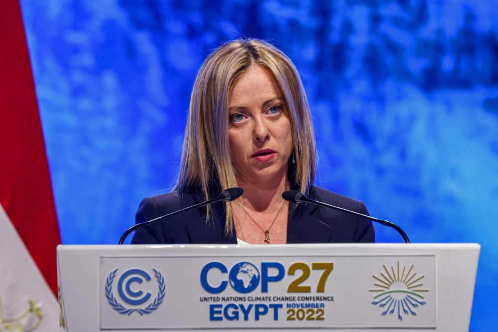 Italy's Prime Minister Giorgia Meloni delivers a speech at the leaders' summit of the COP27 climate conference at the Sharm el-Sheikh International Convention Centre, in Egypt's Red Sea resort city of the same name, on November 7, 2022. (AFP/Ahmad Gharabli)