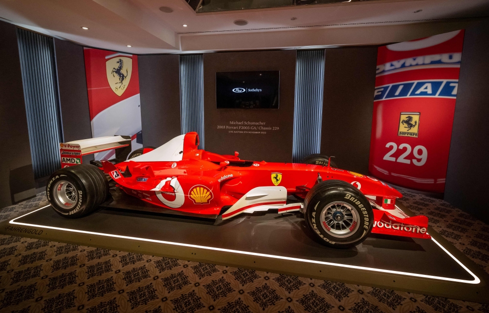 This file photo taken on November 4, 2022 shows F1 World Champion Michael Schumacher's Formula One Ferrari F2003 GA with chassis number 229 during Sotheby's auction house preview in Geneva. (Photo by Fabrice COFFRINI / AFP)
