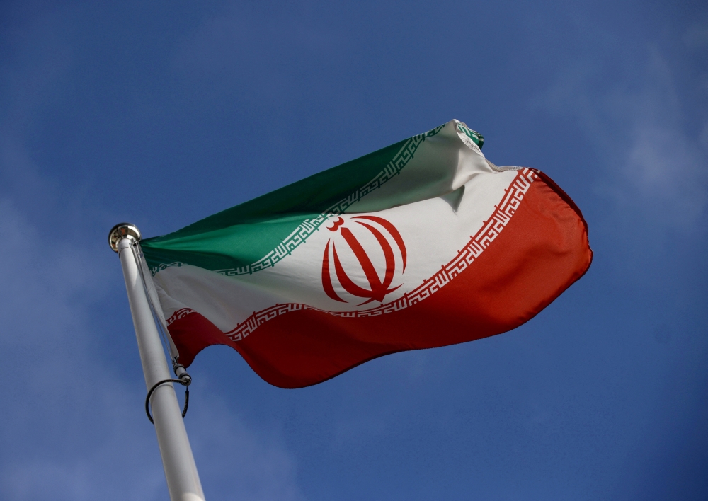 The Iranian flag waves in front of the International Atomic Energy Agency (IAEA) headquarters in Vienna, Austria, March 1, 2021. File Photo / Reuters
