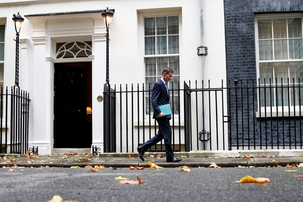 Britain's Chancellor of the Exchequer Jeremy Hunt walks at Downing Street in London, Britain, November 17, 2022. Reuters/Peter Nicholls