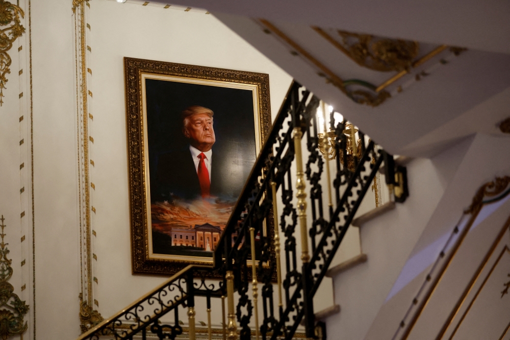 A portrait of former US President Donald Trump over the White House is seen on a stairway of his Mar-a-Lago estate before he announced that he will once again run for US president in the 2024 US presidential election, during an event at in Palm Beach, Florida, US, on November 15, 2022. REUTERS/Jonathan Ernst/File Photo