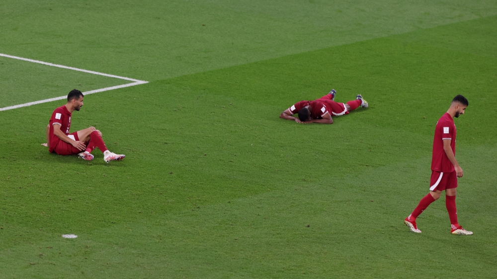 Qatar players react after Senegal's Bamba Dieng scored their third goal during World Cup Qatar 2022 match between Qatar and Senegal at Al Thumama Stadium on November 25, 2022. (REUTERS/Molly Darlington)