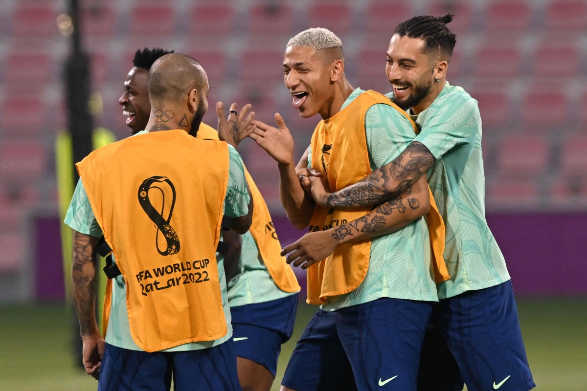 Brazil’s forward Richarlison with teammates during a training session at Al Arabi SC in Doha yesterday.