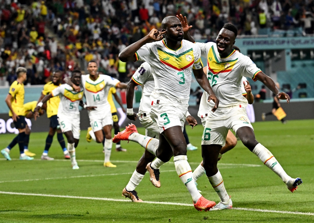 Senegal's Kalidou Koulibaly celebrates scoring their second goal with teammates during Qatar 2022 World Cup Group A match between Senegal and Ecuador at Khalifa International Stadium on November 29, 2022. (Reuters/Dylan Martinez)