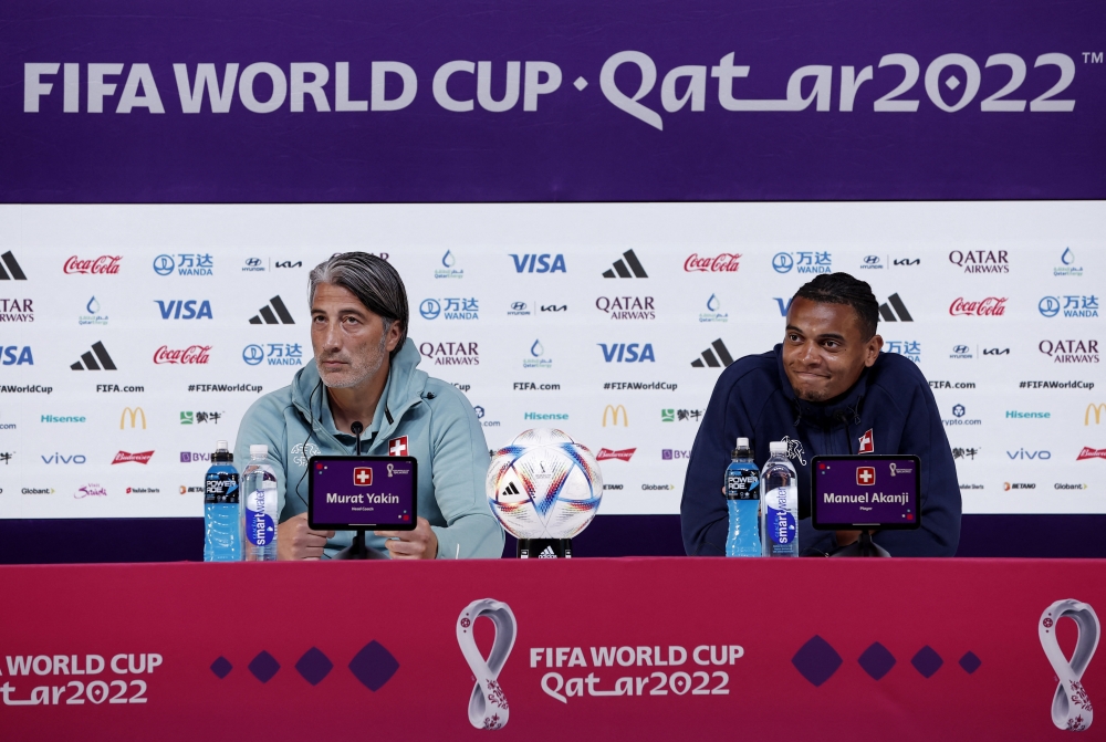 Switzerland coach Murat Yakin and Switzerland's Manuel Akanji during the FIFA World Cup Qatar 2022  Switzerland Press Conference at the Main Media Center, Doha, Qatar, on December 1, 2022.   REUTERS/Benoit Tessier