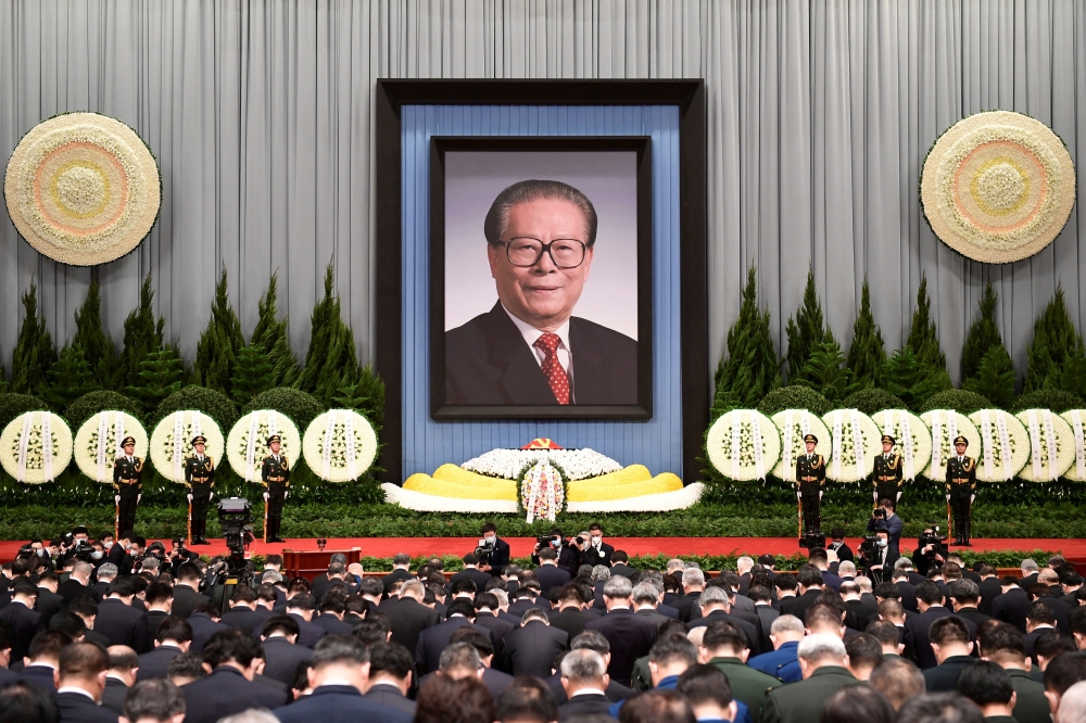 Officials attend a memorial meeting for former Chinese President Jiang Zemin at the Great Hall of the People in Beijing, China, on December 6, 2022. cnsphoto via REUTERS