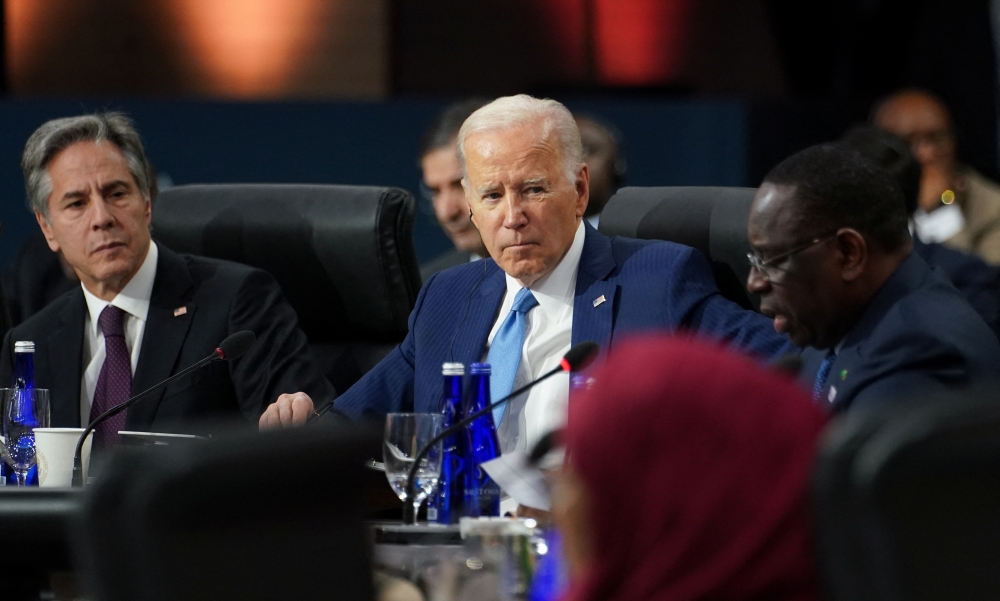 US President Joe Biden listens to remarks from Senegalese President Macky Sall (R) during the US-Africa Summit Leaders Session on partnering on the African Union’s Agenda 2063, in Washington, US, on December 15, 2022. REUTERS/Kevin Lamarque