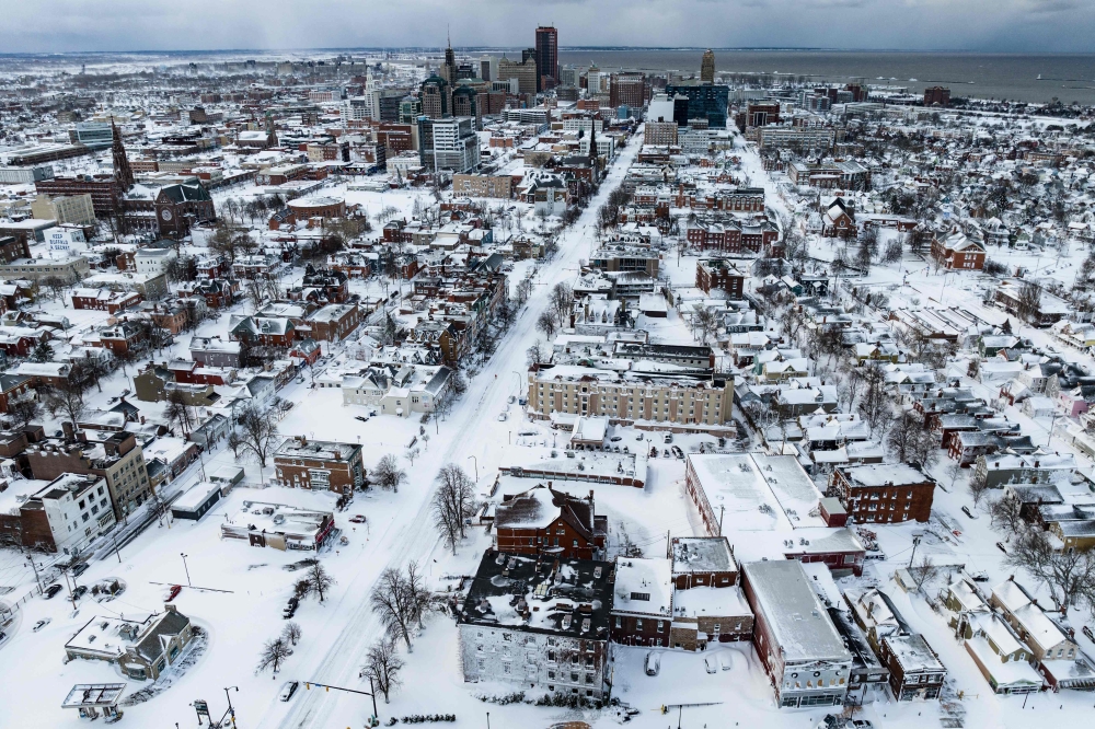 Snow blankets the city in this aerial drone photograph in Buffalo, New York, on December 25, 2022. Photo by Joed Viera / AFP