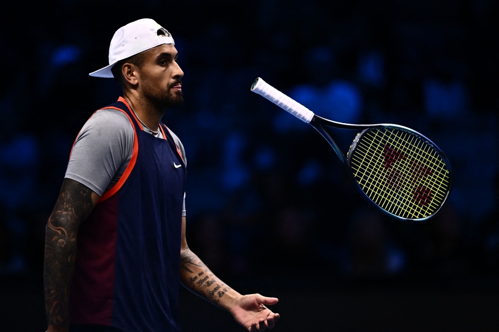 This file photo taken on November 14, 2022 shows Australia's Nick Kyrgios reacting during his men's double round-robin match with Australia's Thanasi Kokkinakis against Britain's Neal Skupski and The Netherlands Wesley Koolhof at the ATP Finals tennis tournament in Turin. Photo by Marco BERTORELLO / AFP
