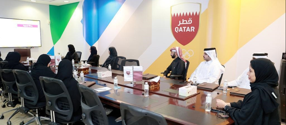 Officials and Community College of Qatar students during a session at QOC. 