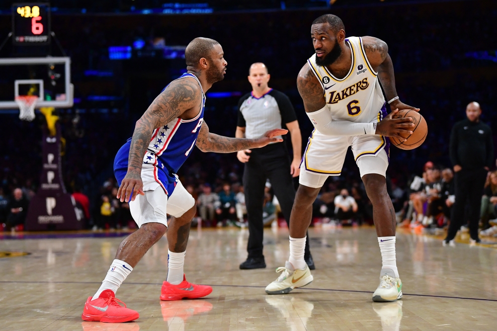 Los Angeles Lakers forward LeBron James (6) controls the ball against Philadelphia 76ers forward PJ Tucker (17) during the second half at Crypto.com Arena. Gary A. Vasquez-USA TODAY Sports