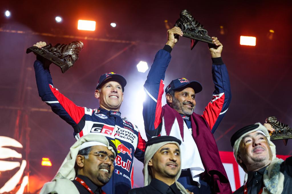 Toyota Gazoo Racing’s Qatari driver Nasser Saleh Al Attiyah celebrates with co-driver Mathieu Baumel of France, Qatar Motor and Motorcycle Federation President Abdulrahman bin Abdullatif Al Mannai and officials after winning his fifth Dakar Rally title in Saudi Arabia, on Sunday. PIC: RED BULL