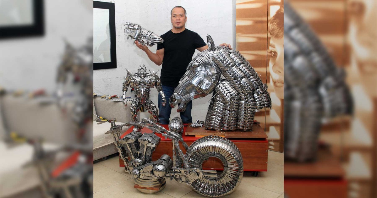 Filipino artist Danny Ponce with his spoon and fork sculptures. Photos by Salim Matramkot/The Peninsula