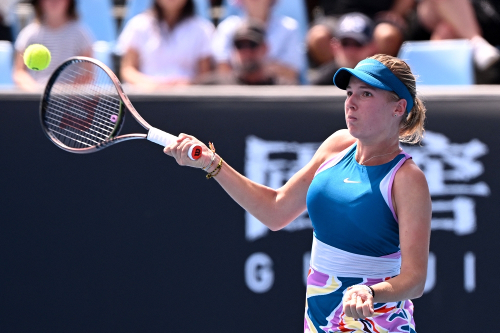 Czech Republic's Linda Fruhvirtova hits a return against Czech Republic's Marketa Vondrousova during their women's singles match on day six of the Australian Open tennis tournament in Melbourne on January 21, 2023. (Photo by William West / AFP)