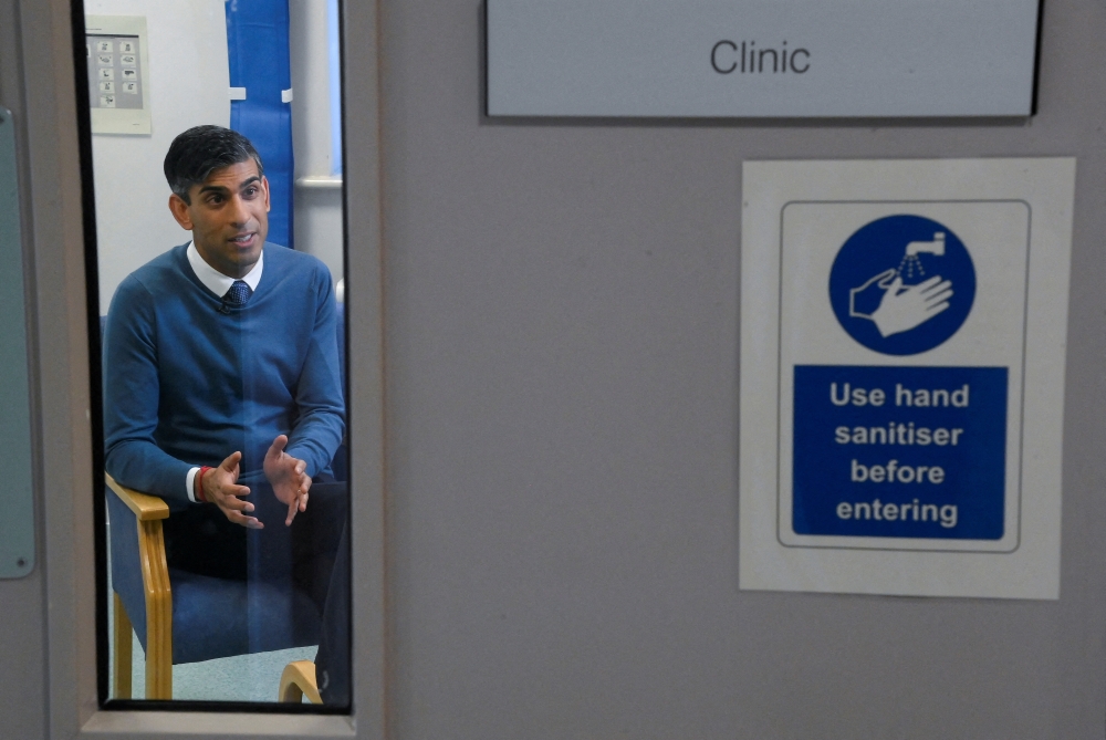 British Prime Minister Rishi Sunak attends a media broadcast interview during his visit to Berrywood Hospital in Northampton, Britain, January 23, 2023. REUTERS/Toby Melville/Pool