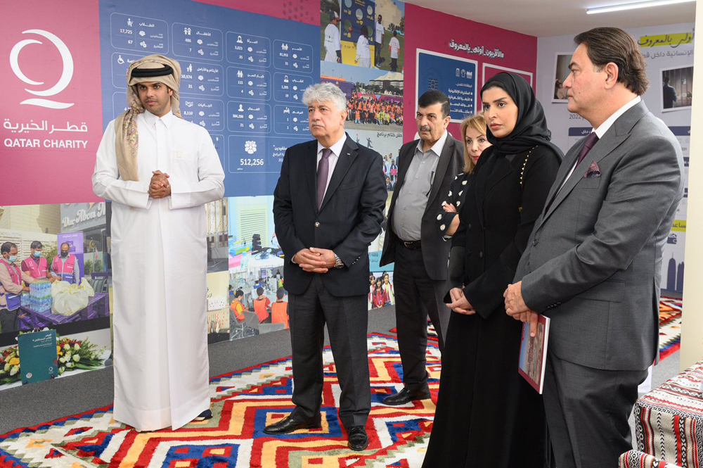 Minister of Social Development and Family H E Maryam bint Ali bin Nasser Al Misnad (second right) with other officials at the opening of the exhibition.