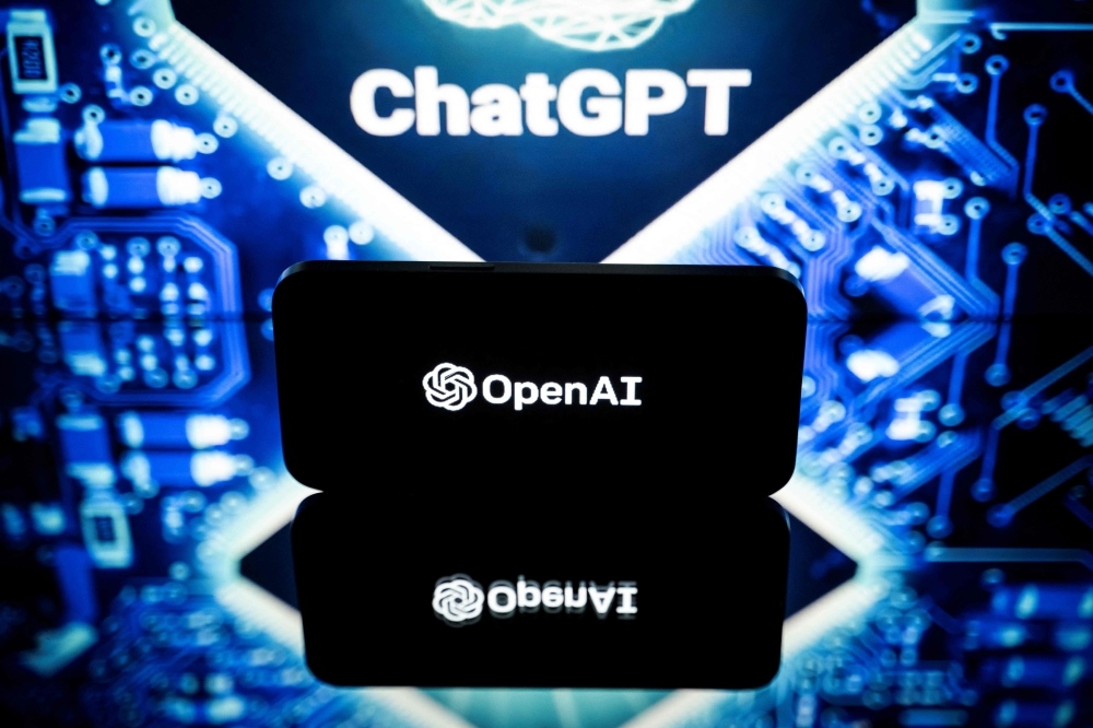This picture taken on January 23, 2023 in Toulouse, southwestern France, shows screens displaying the logos of OpenAI and ChatGPT. - ChatGPT is a conversational artificial intelligence software application developed by OpenAI. (Photo by Lionel BONAVENTURE / AFP)