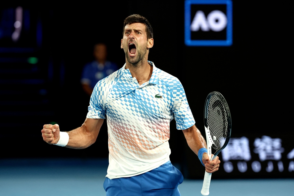 Serbia's Novak Djokovic reacts on a point against Russia's Andrey Rublev during their men's singles quarter-final match on day ten of the Australian Open tennis tournament in Melbourne on January 25, 2023. (Photo by DAVID GRAY / AFP) 